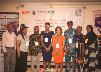 A selected few standing in a group picture at the event