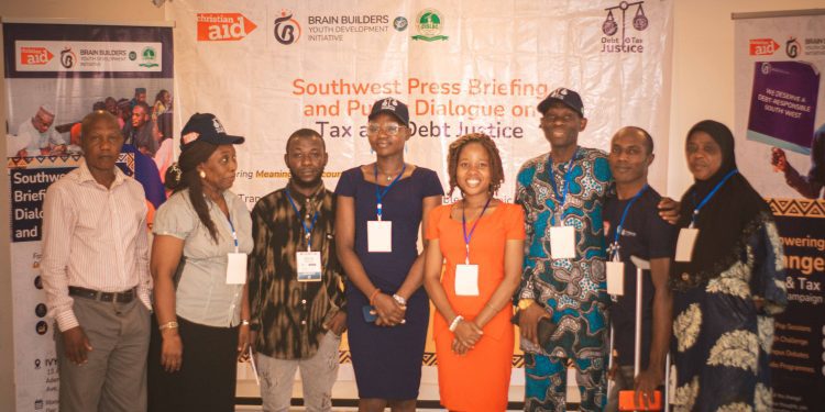 A selected few standing in a group picture at the event