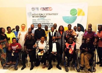 A group of people standing indoor