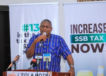 A man on the high table with the microphone