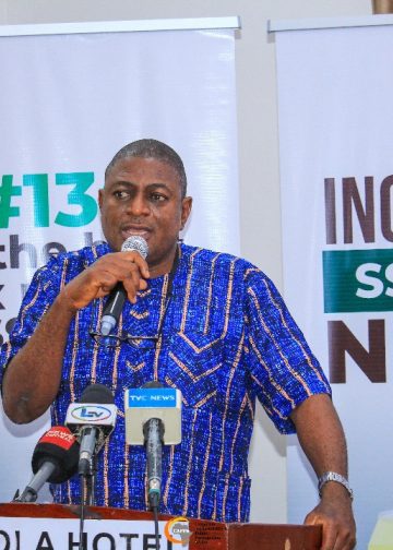 A man on the high table with the microphone