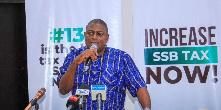 A man on the high table with the microphone