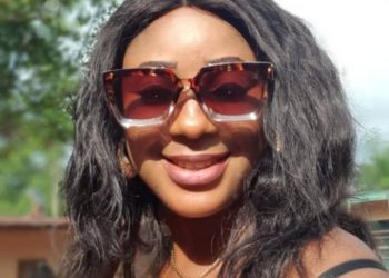 Image of the face view of a woman on glasses outdoor