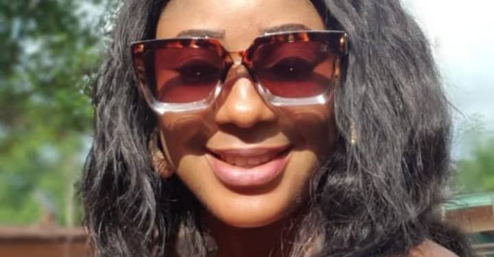 Image of the face view of a woman on glasses outdoor