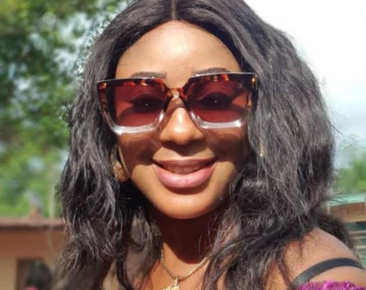 Image of the face view of a woman on glasses outdoor