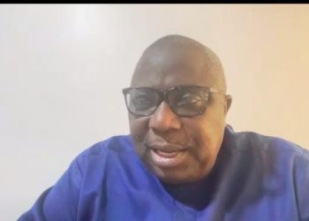 A man sitting indoor