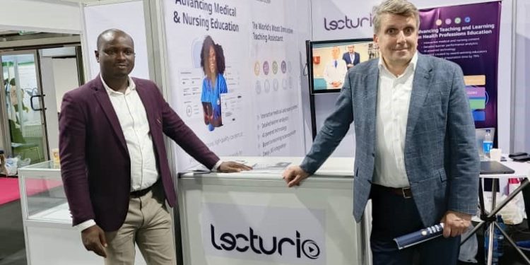 Two men standing together at an exhibition stand