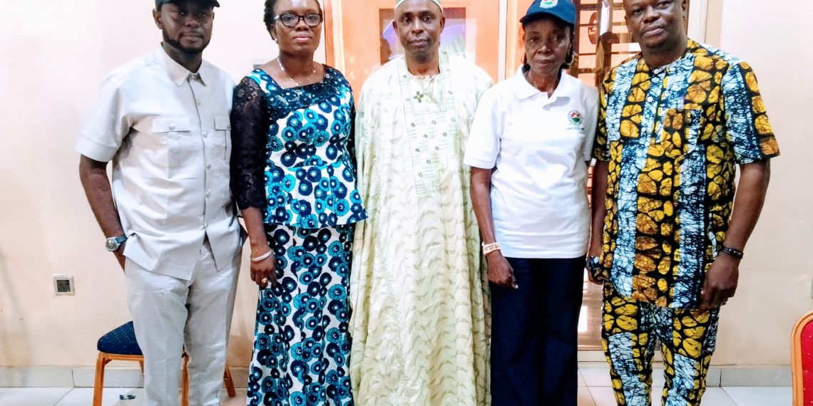 five people standing indoor