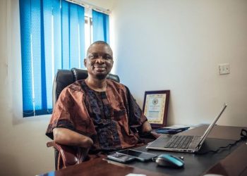 A man sitting indoor