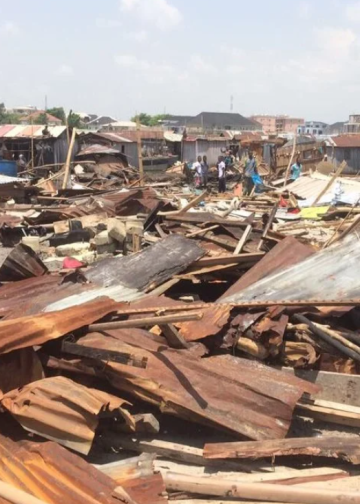 Zinc and plank of wood scattered on the floor