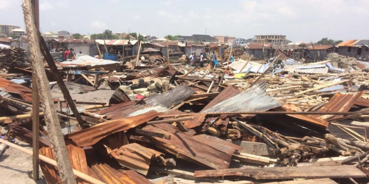 Zinc and plank of wood scattered on the floor