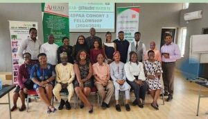 A group of people standing and sitting indoor