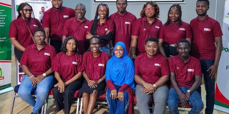 A group of people standing and sitting indoor