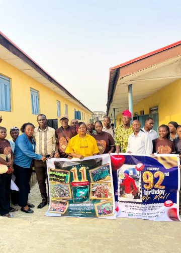 A group picture of CEE-HOPE's Executive Director, Ms. Betty Abah, teachers of Oke-Ira Primary School and students and parents.