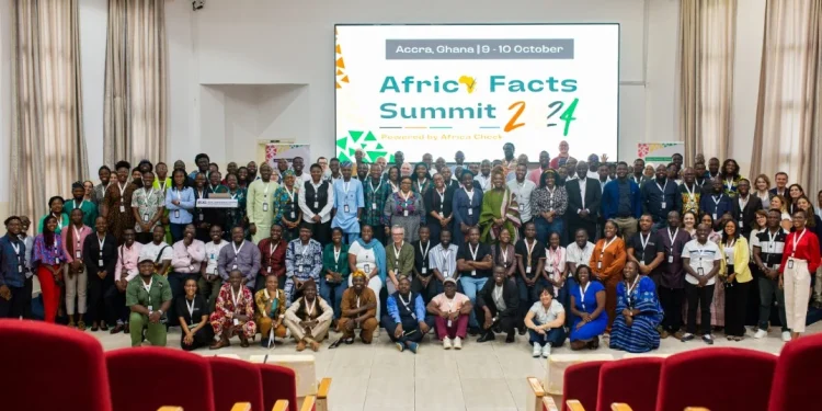 Image of many people sitting and standing indoor