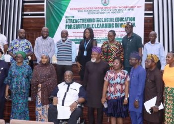 A group of people standing indoor
