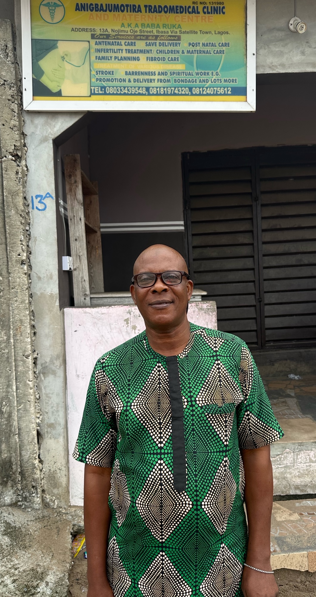 A man with glasses standing outdoor