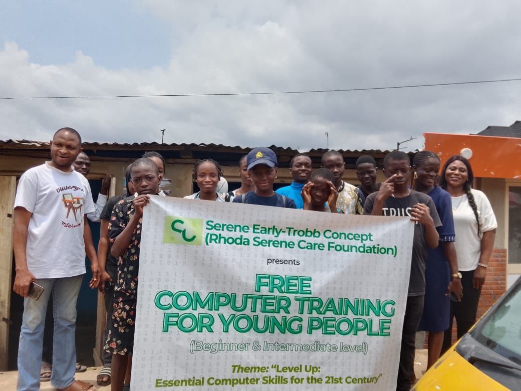 A group of people standing outdoor holding a banner