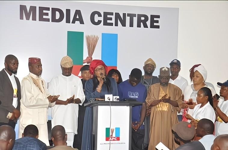 Group of people standing indoor