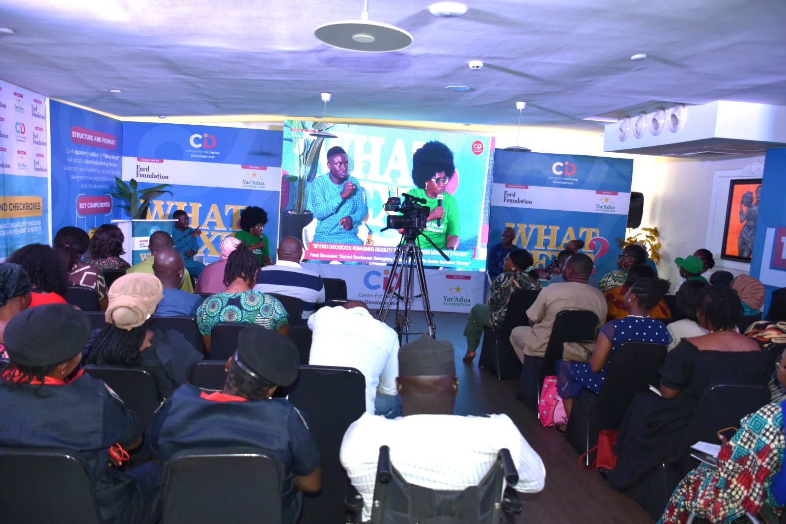 A many people seated indoors