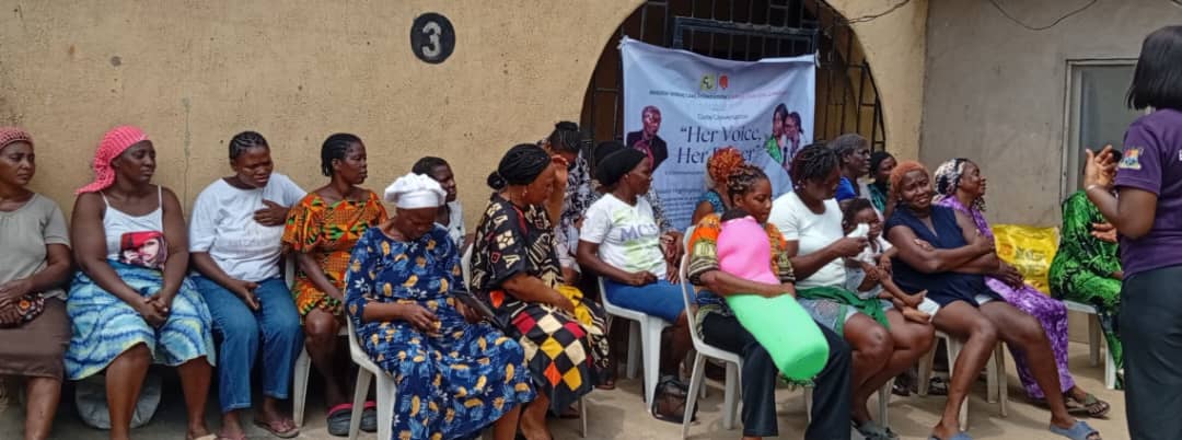 A group of women seated outdoors