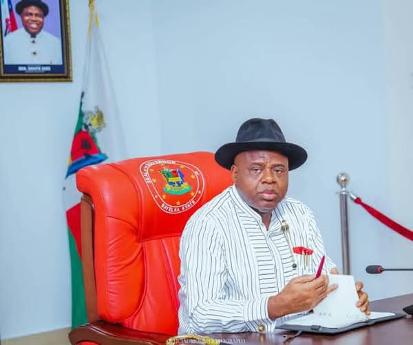 Image of governor Diri sitting in a chair indoor