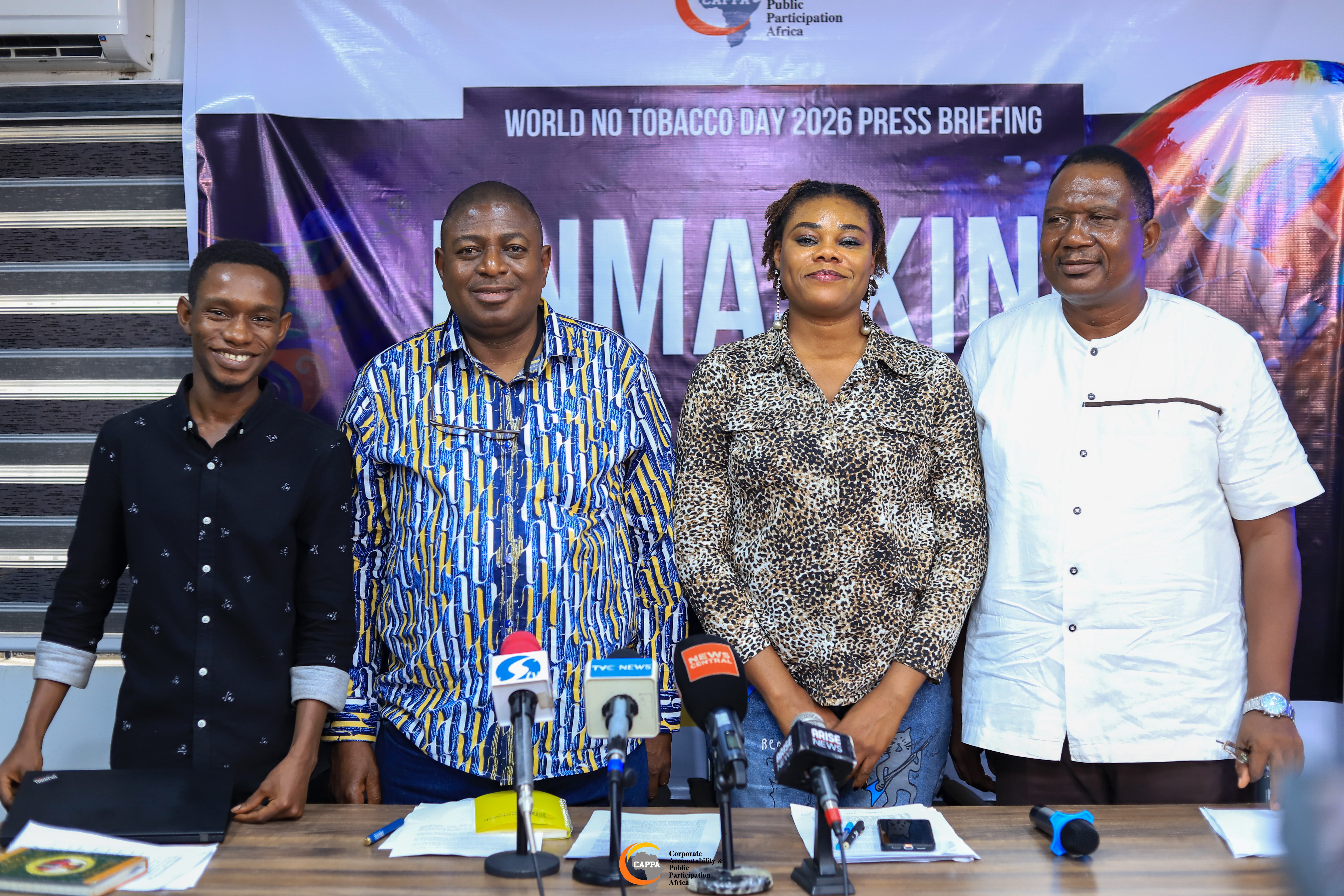 Four people standing behind against a banner that has the inscribtion the World No Tobacco Day. The four people are; Anjola, Oluwafemi, Zikora and Adegoke.