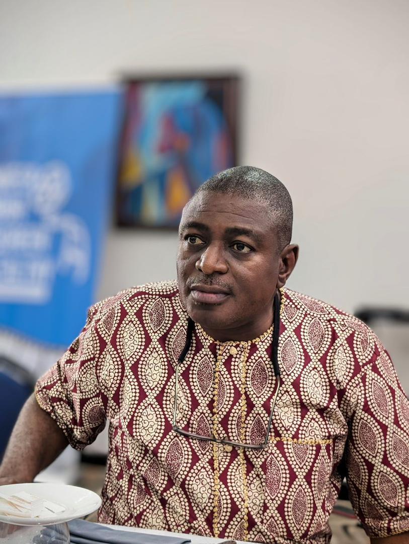 Mr Akinbode Oluwafemi the Executive Director of CAPPA sitting indoors