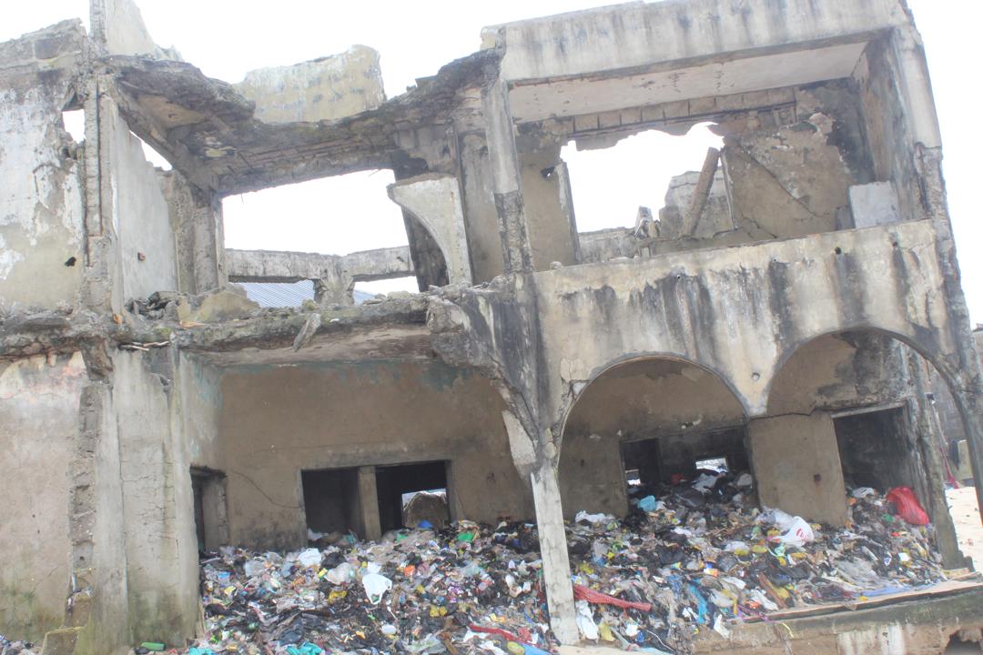A demolished storey building with rubbles